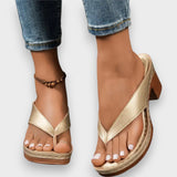Zapatilla con tacón